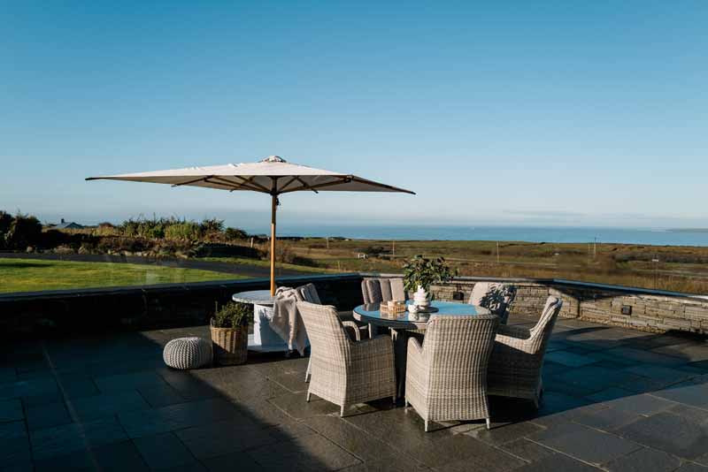 Natural stone patio installation by Elm Landscaping